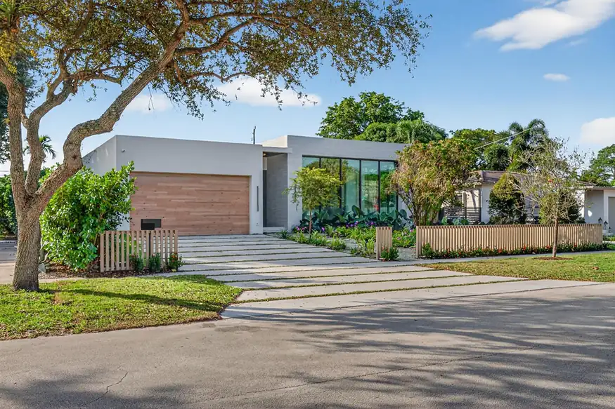 Daytime exterior in the client-supplied Miami project photographs, with the address plaque redacted