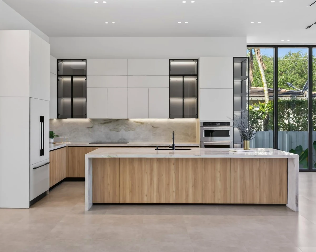 Kitchen cabinetry and wood-finish island in the client-supplied Miami builder project photograph.